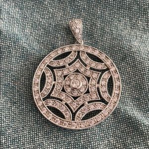 Crystal and silver tone circle pendant